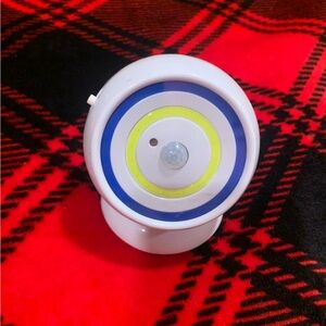White Motion Sensor Light with Blue and Yellow Accents